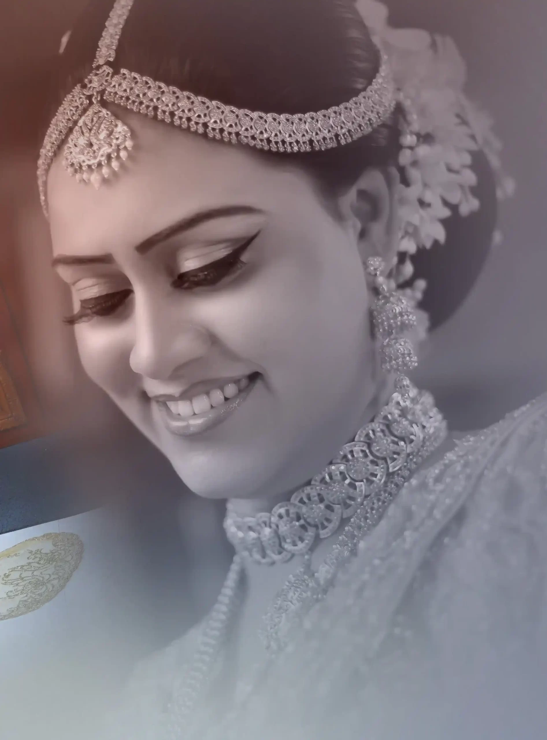 Close-up portrait of a beautiful traditional bride showcasing her makeup and jewelry.