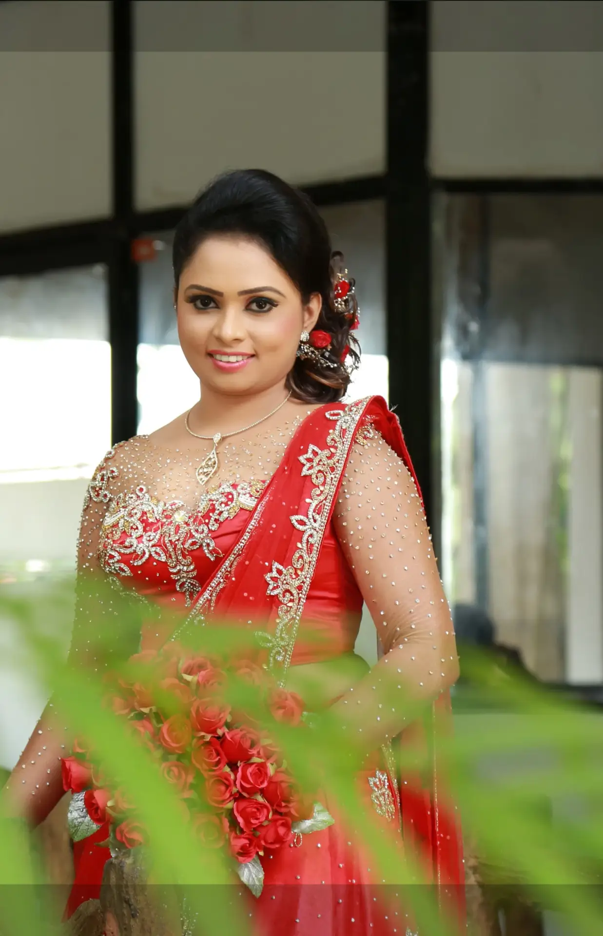 Indian fashion-inspired Sri Lankan couple, girl in a striking red saree.