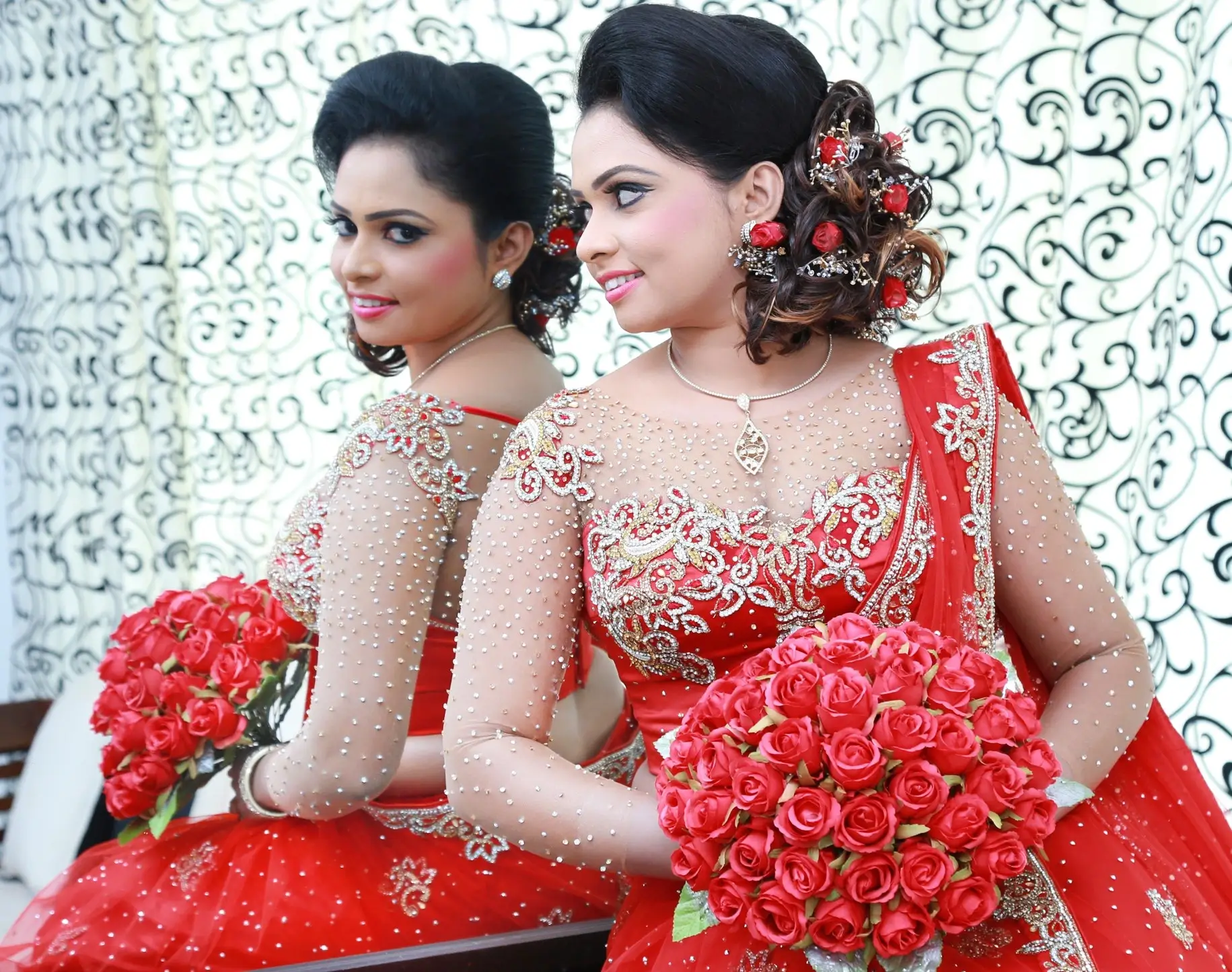 Sri Lankan couple in traditional Indian attire, red saree.