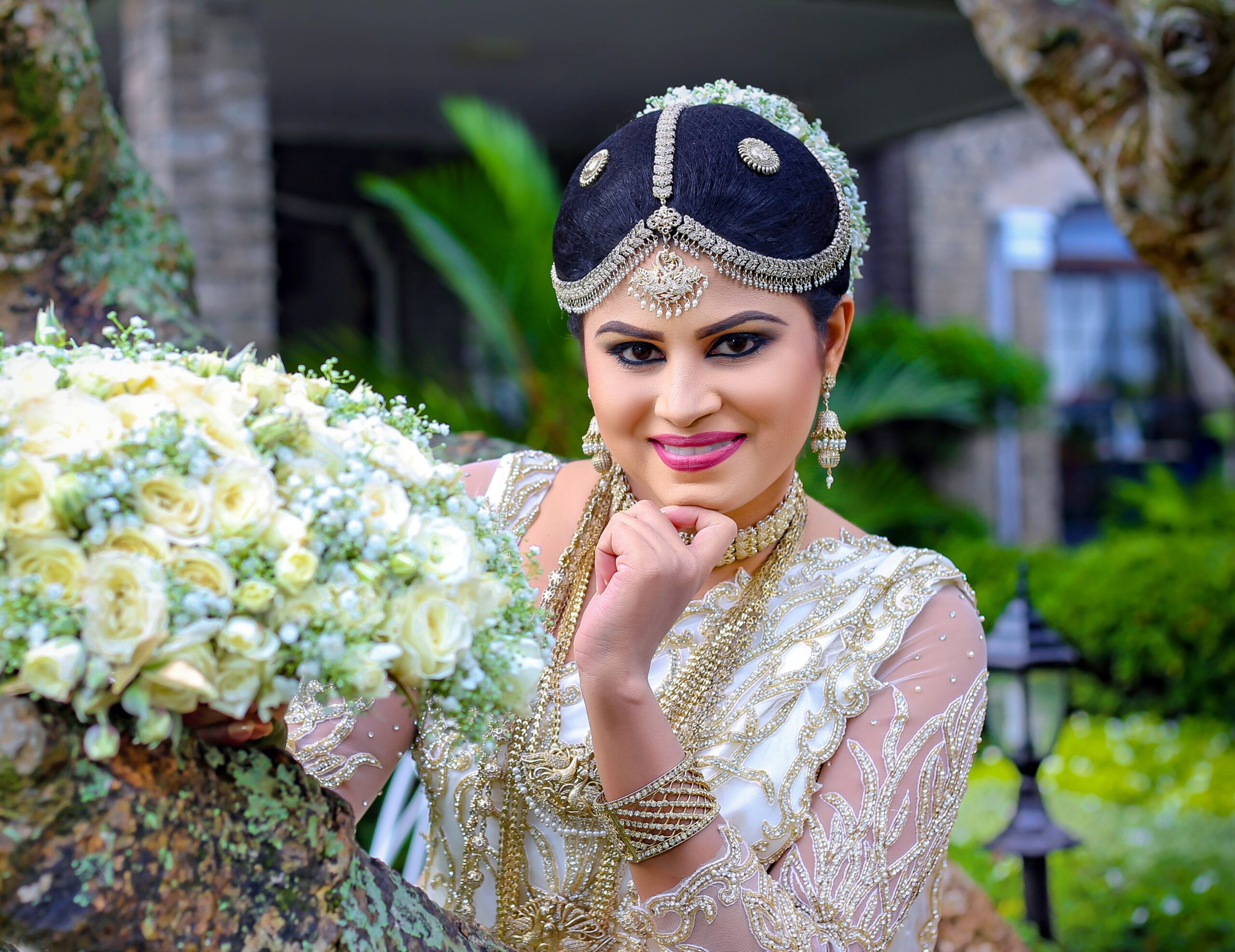 Bride holding a bouquet of white blooms