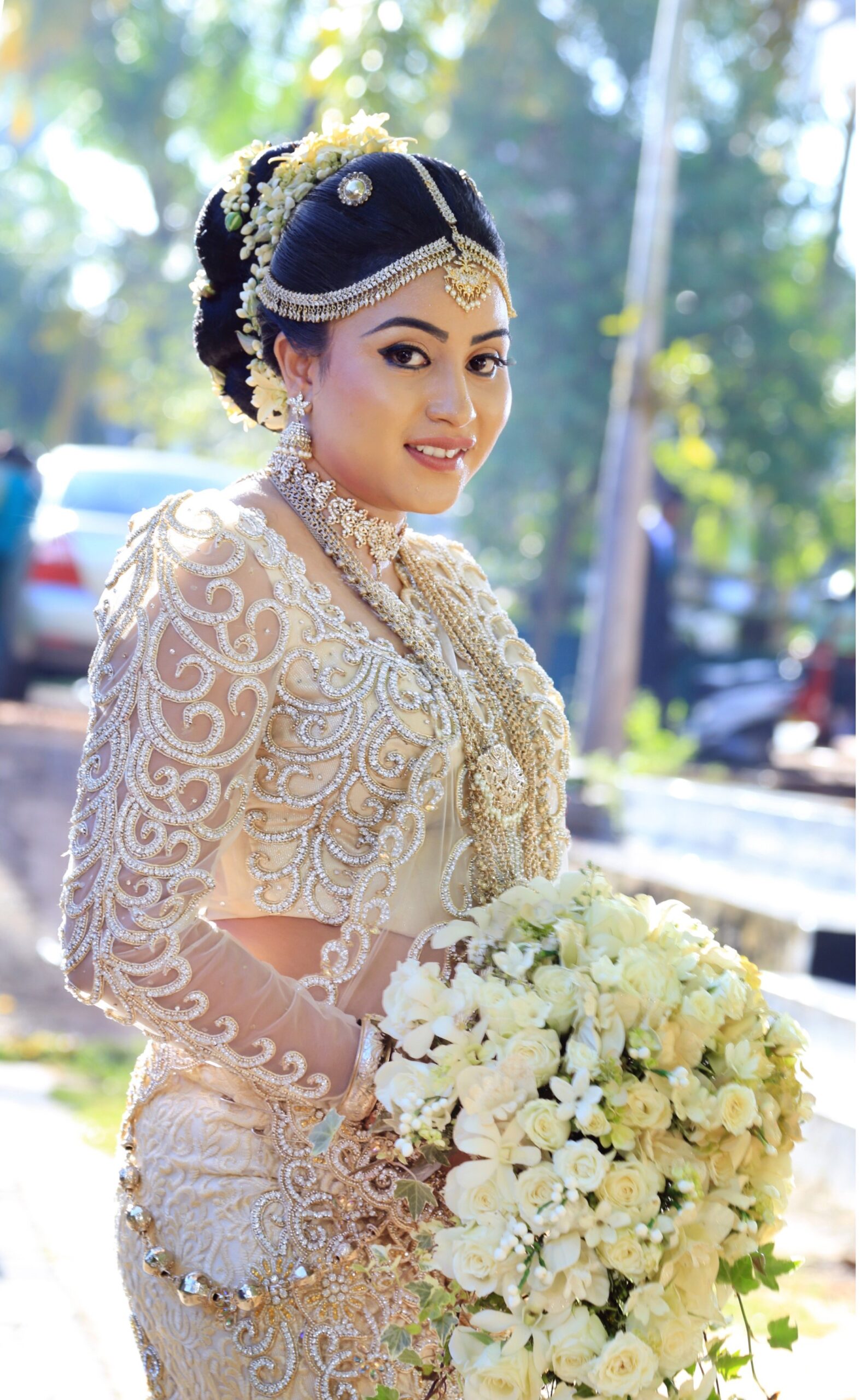 Close-up of the bride's bouquet against her dress.