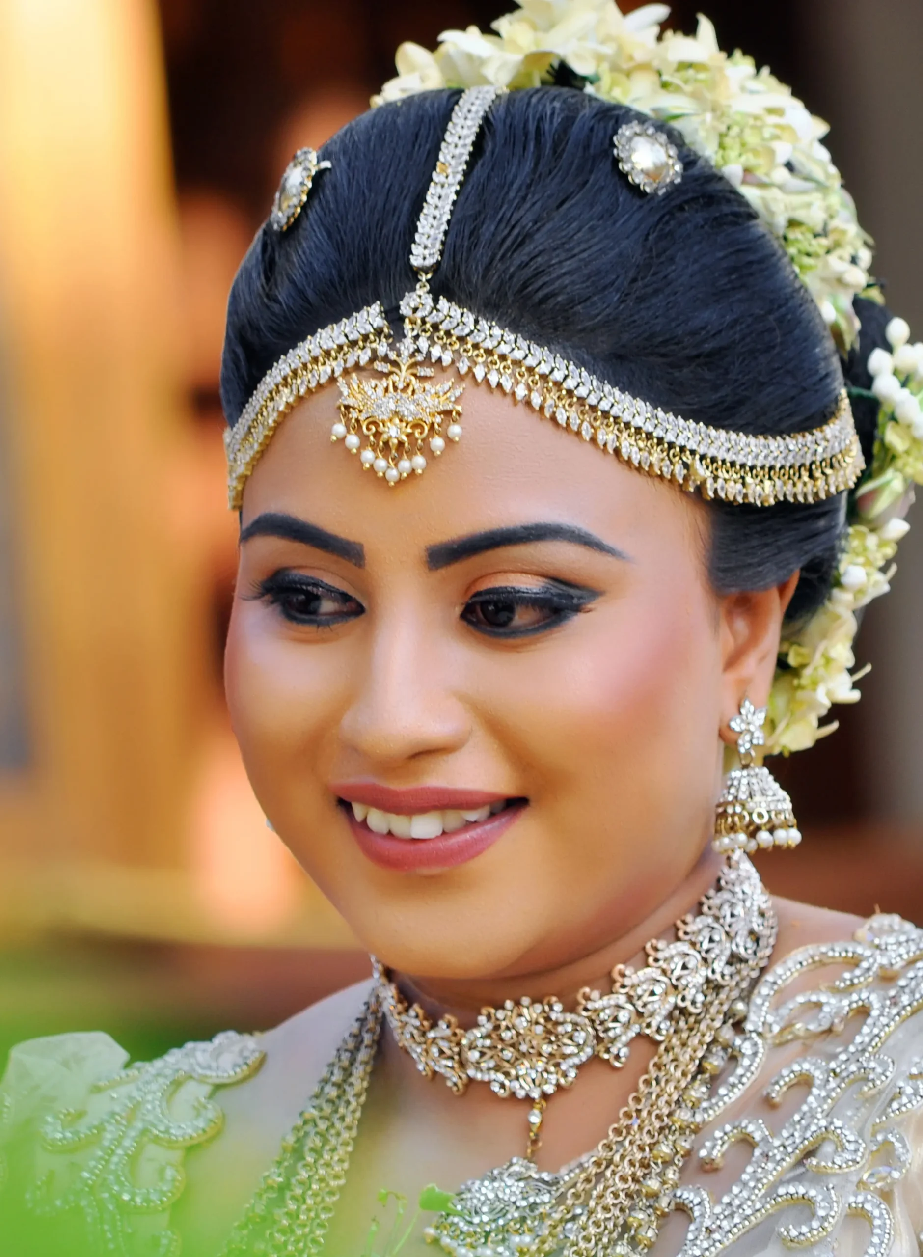 Bride sitting on a swing, her dress cascading down.