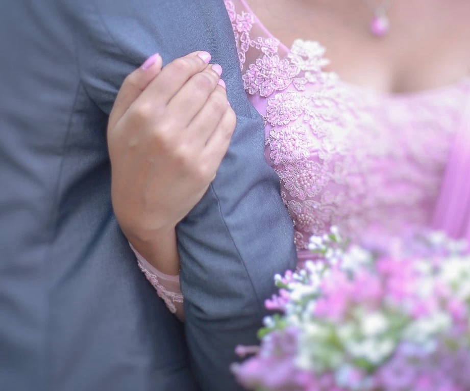 Bride and groom walking away hand in hand