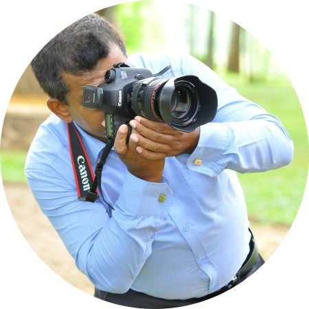 A photographer with his camera taking photos.